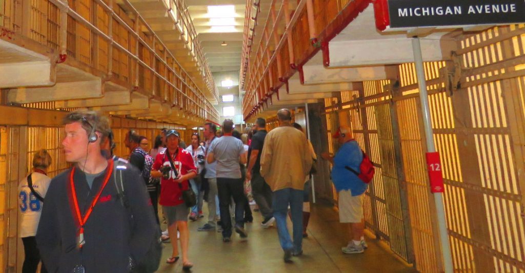 visit-alcatraz-prison-cell-block-tourists-walking-by-inmates-cells---x--x